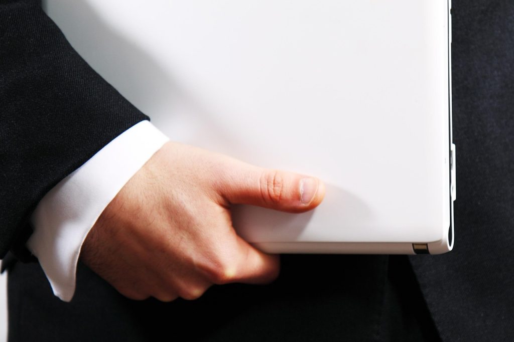 man holding electronic device, ready to discuss the project