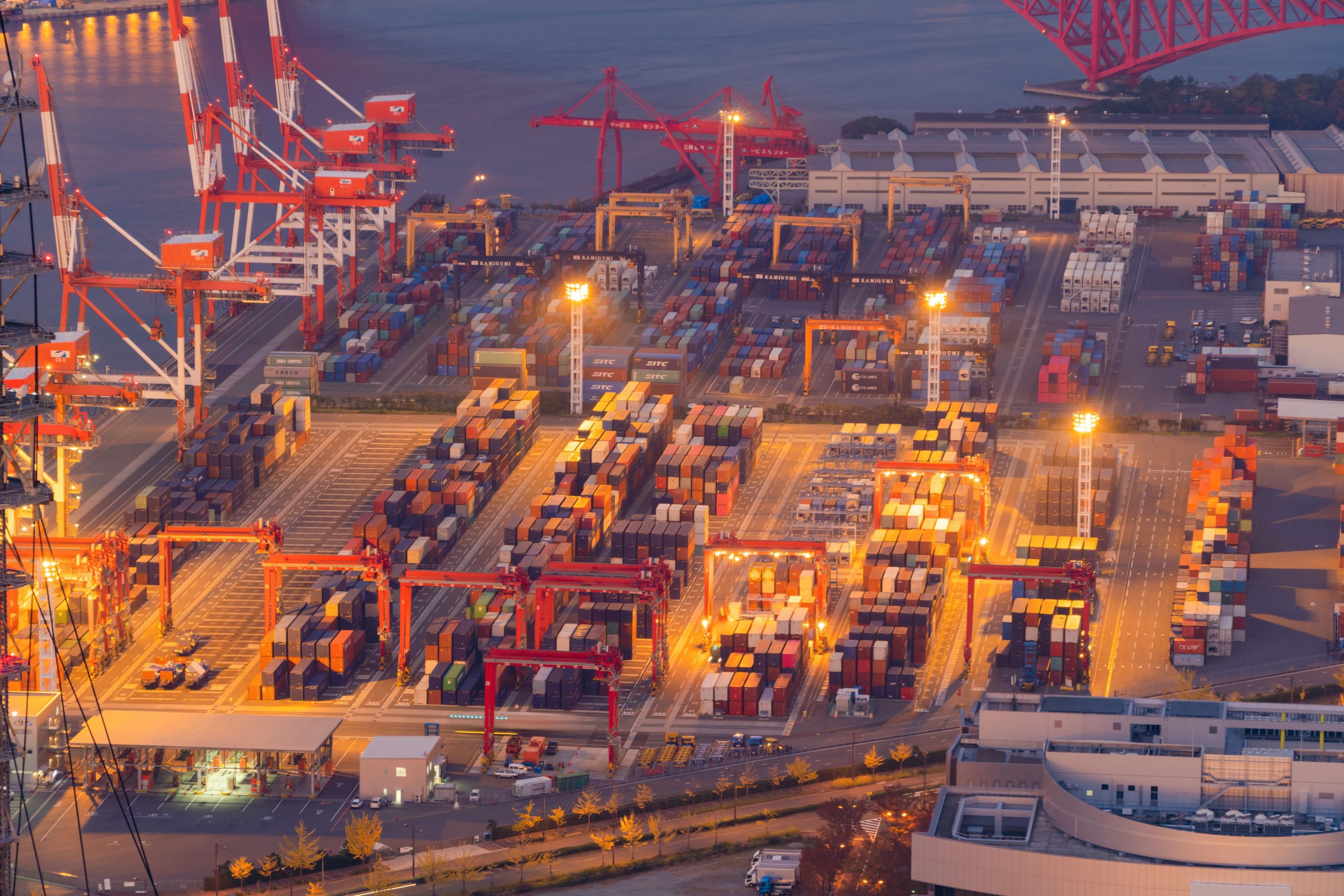 Aerial view of container cargo ship in the export and import business and logistics international goods in urban city. Shipping to the harbor by crane in Osaka Harbour, Japan Aerial view of container cargo ship in the export and import business and logistics international goods in urban city. Shipping to the harbor by crane in Osaka Harbour, Japan